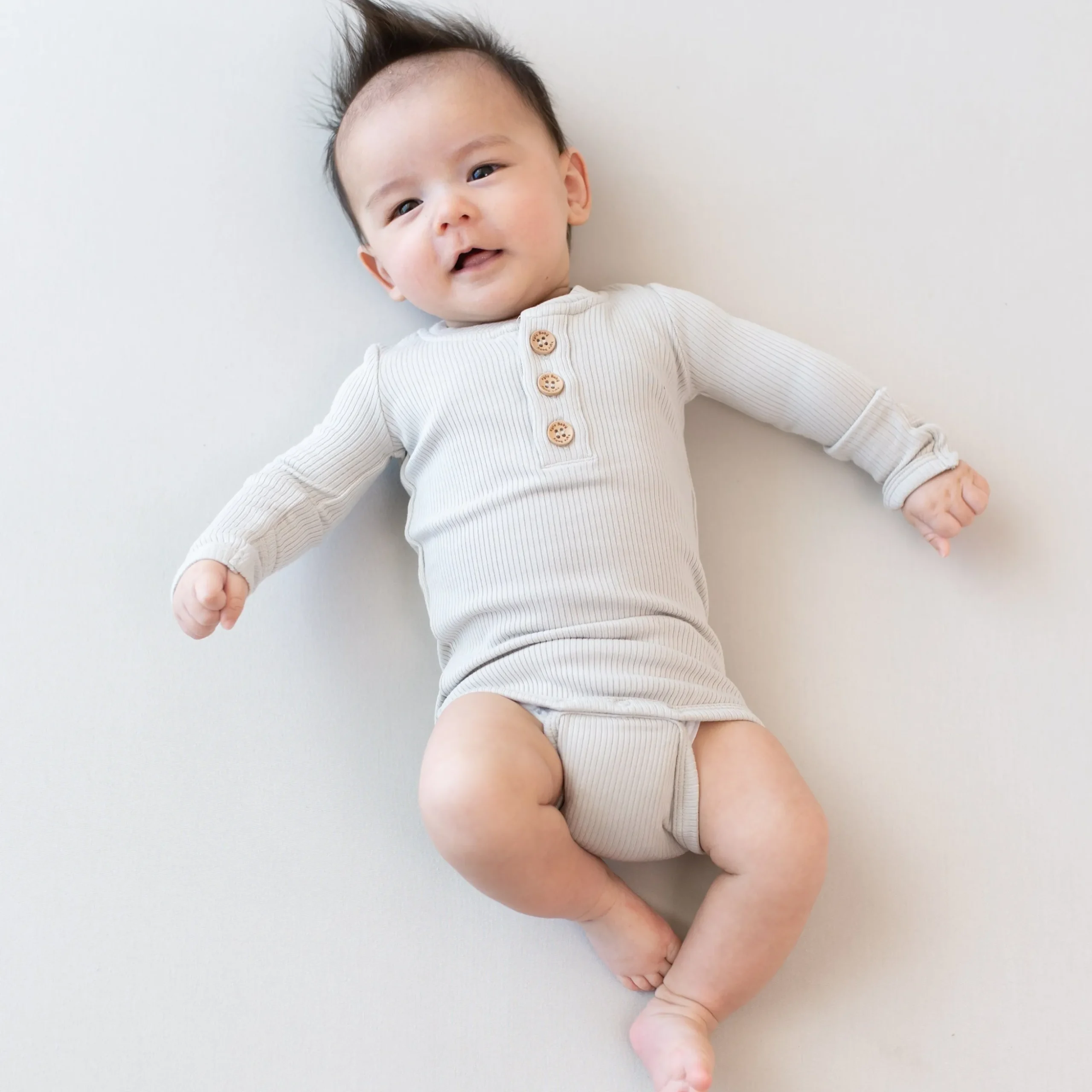 Ribbed Long Sleeve Henley Bodysuit in Oat