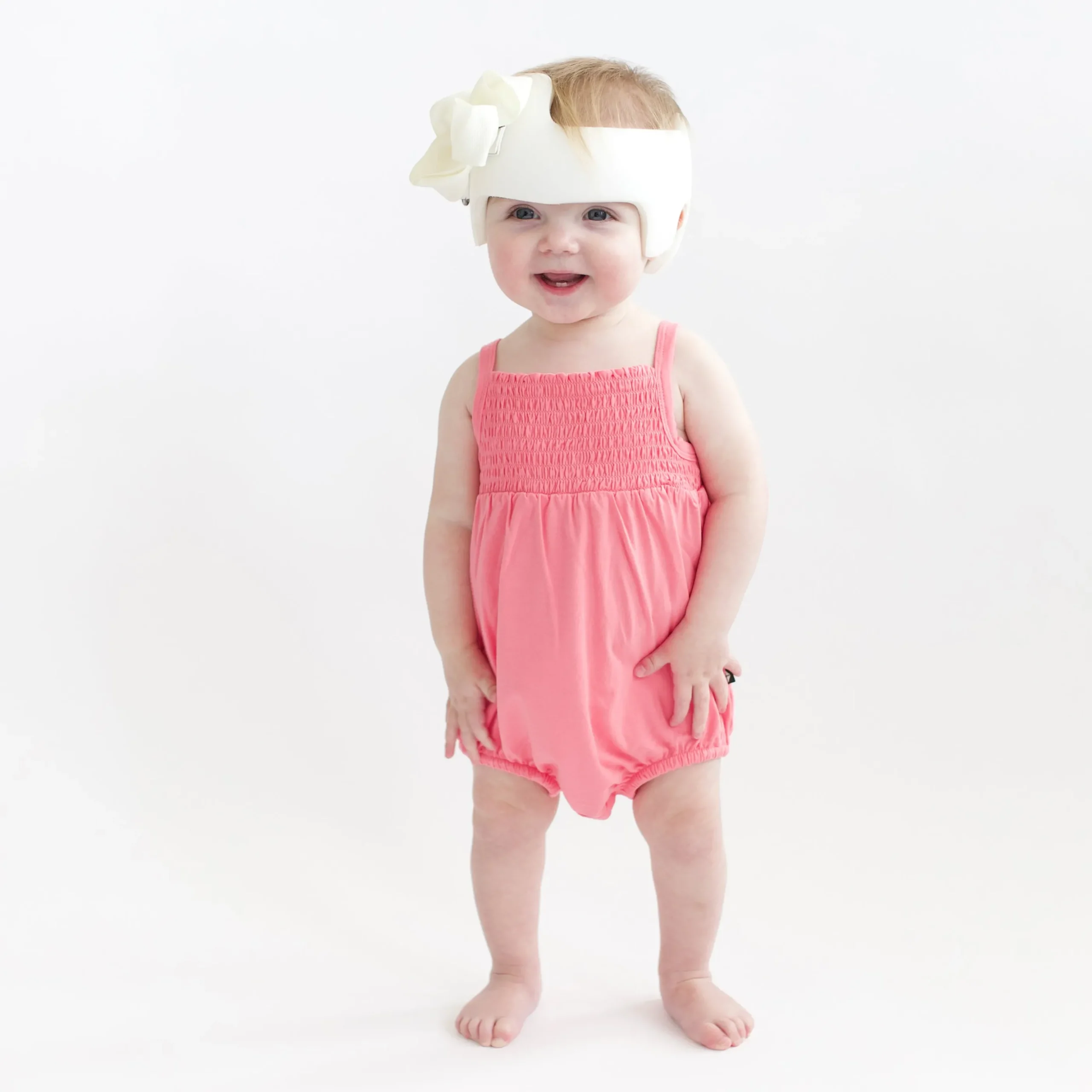 Smocked Bubble Romper in Guava