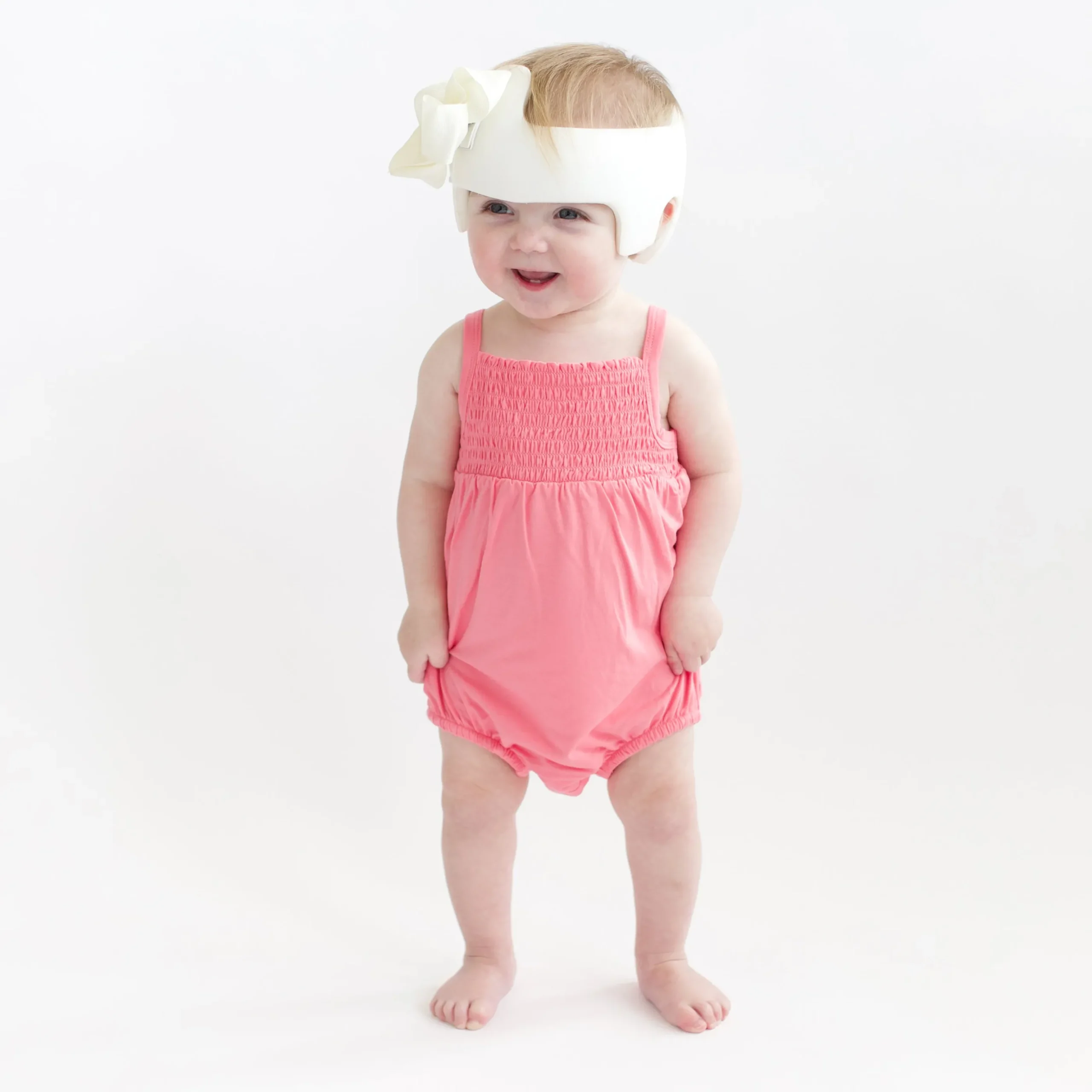 Smocked Bubble Romper in Guava